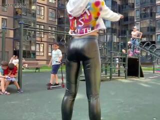 Blonde whore is showing her leather leggings ass in public!